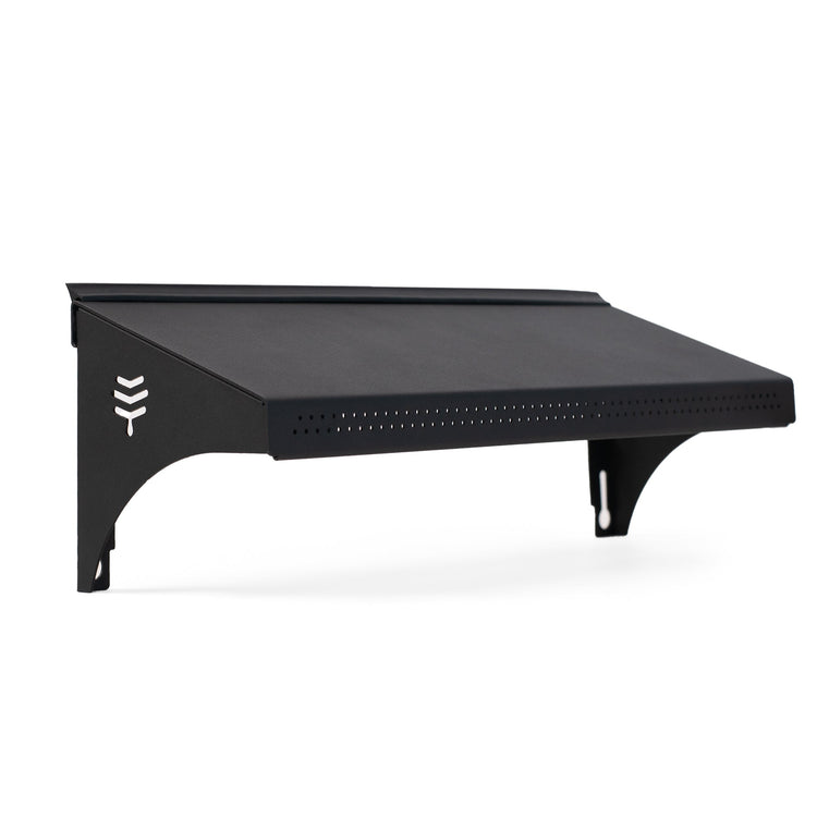 A black weather guard accessory for a hive, featuring the Flow brand logo on the side.